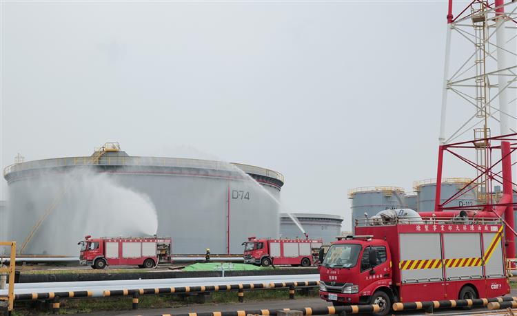Fire brigade personnel from CPC's Dalin Refinery conduct a protective cooling drill using a fire monitor.